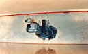 Mural painting in an autohouse - an engine floats over the clouds
