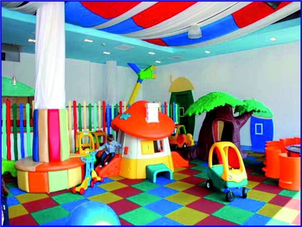 Kidsland theme playground planning and design - the mini disco
 Kids Children indoor playground design and planning issues - between 2 supports the mini disco was positioned with a small platform and suspended lighting effects. A very fun area for the children between 3-7 years.